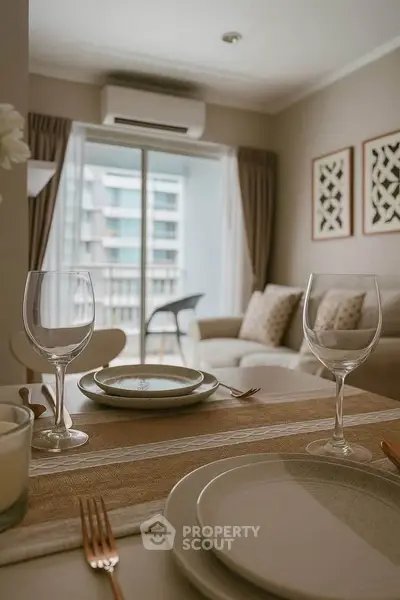 Elegant dining setup in a modern living room with balcony view, perfect for urban living.