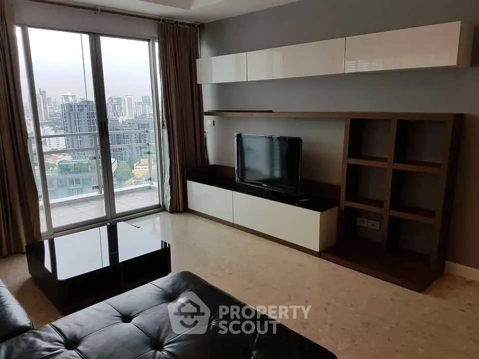 Modern living room with city view and sleek furniture