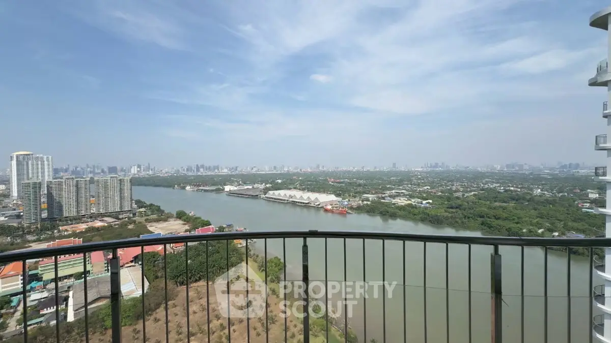 Stunning river view from high-rise balcony with city skyline
