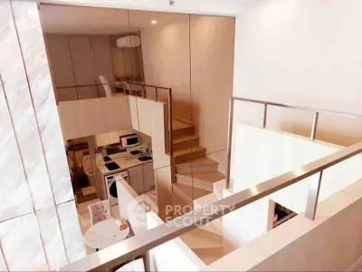 Modern loft apartment with stylish open layout and sleek staircase design