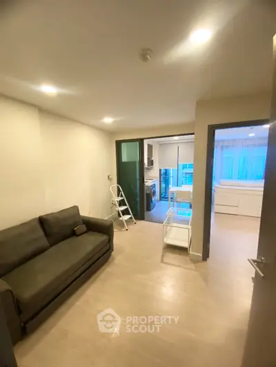 Modern apartment interior with cozy living room and open kitchen layout