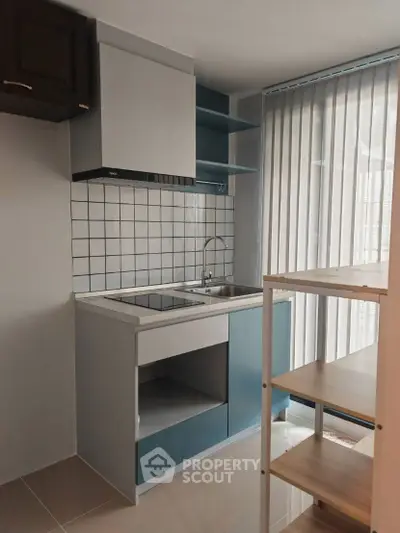 Modern compact kitchen with sleek design and open shelving