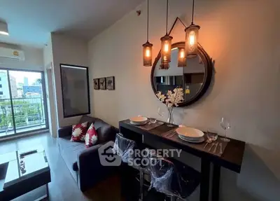 Stylish living room with modern decor and balcony view