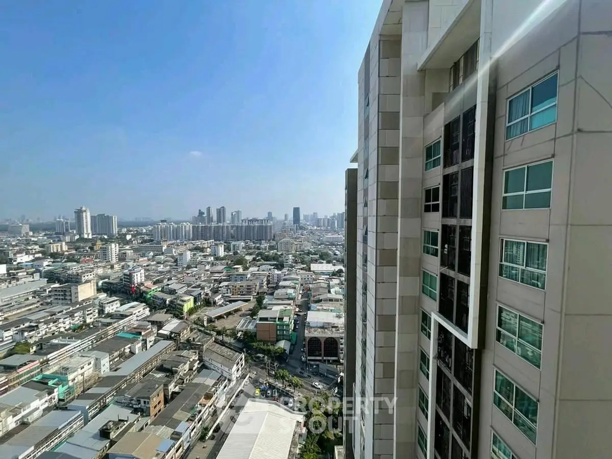 Stunning cityscape view from high-rise building showcasing urban skyline.