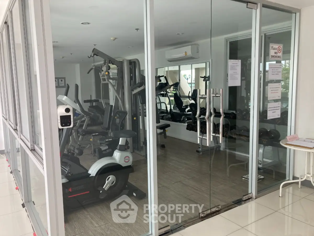 Modern gym with state-of-the-art fitness equipment in a residential building