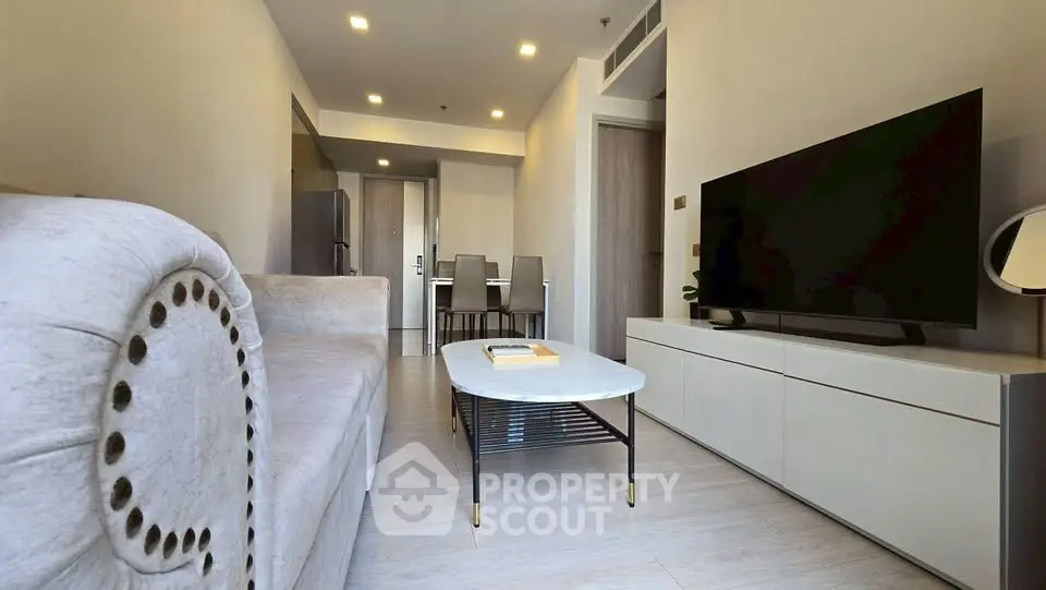 Modern living room with elegant decor and sleek furniture in a stylish apartment.
