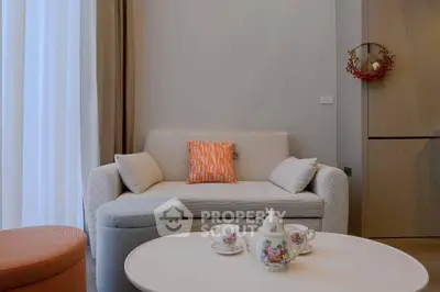 Charming living room with cozy sofa and elegant tea set, perfect for relaxation and entertaining guests.