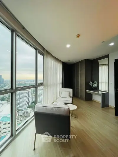 Spacious corner unit with panoramic city view and modern interior design.