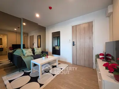 Modern living room with stylish decor and cozy seating area, perfect for relaxation and entertainment.
