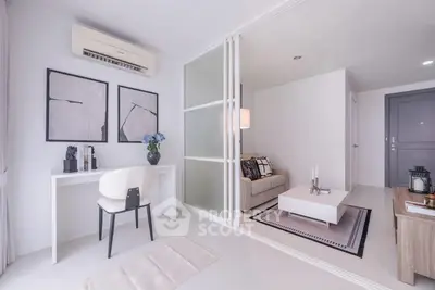 Modern living room with stylish decor and open layout, featuring a cozy seating area and elegant workspace.
