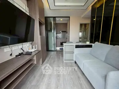 Modern living room with sleek design and open kitchen layout