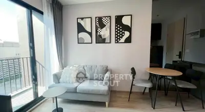 Modern living room with stylish decor and balcony access