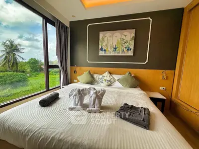 Luxurious bedroom with scenic view and elegant decor, perfect for relaxation and comfort.