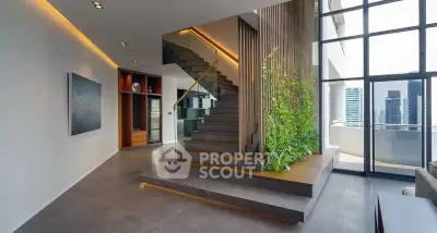 Luxurious modern interior with elegant staircase and city view balcony, perfect for urban living.