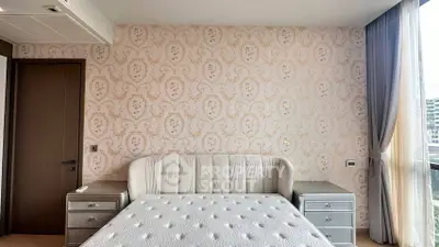Luxurious bedroom with elegant wallpaper and plush bed in modern apartment