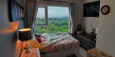Cozy bedroom with stunning city view and elegant decor