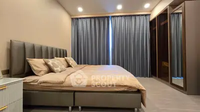 Luxurious bedroom with elegant decor and ample natural light