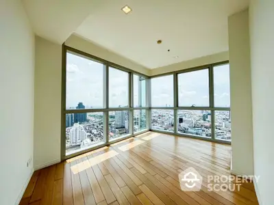 Spacious corner unit with panoramic city views and abundant natural light.