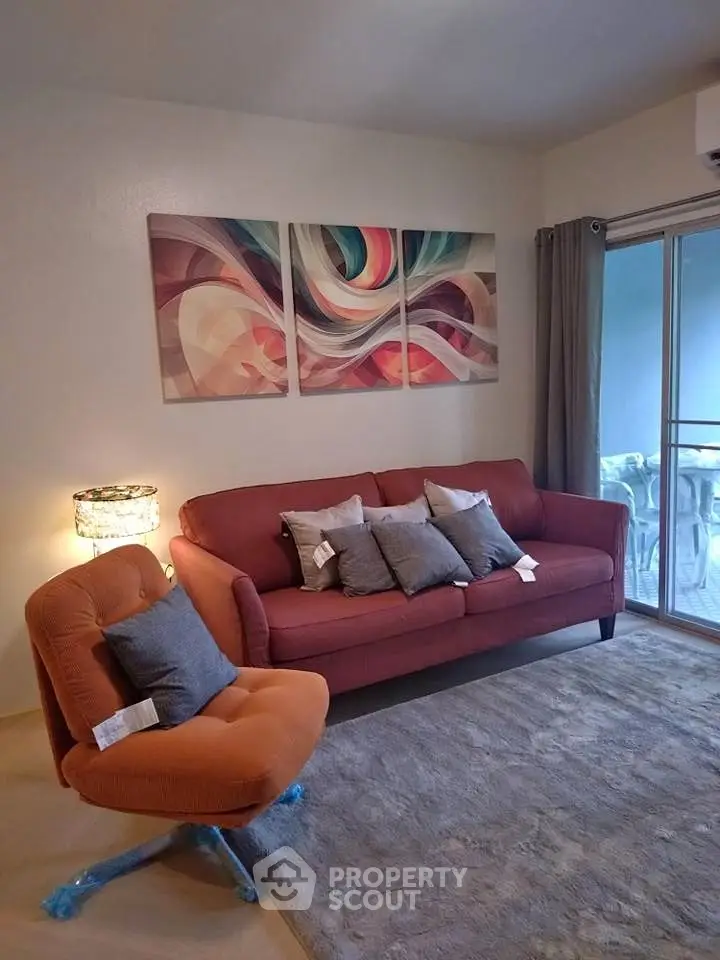 Stylish living room with modern art, cozy sofa, and elegant decor for a comfortable lifestyle.