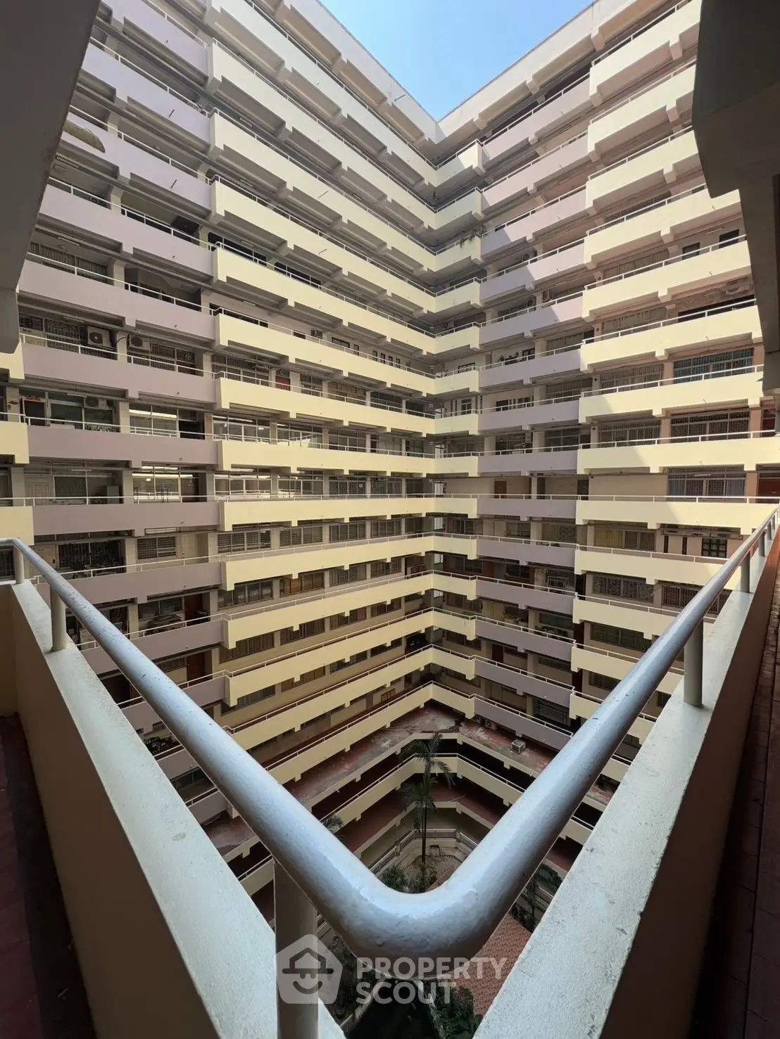 Stunning multi-story building interior with open courtyard and modern design.