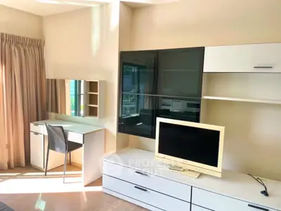 Bright and modern living room with sleek furniture and ample natural light.