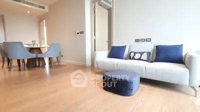 Modern living room with elegant dining area and stylish decor