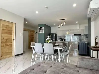 Modern open-plan living room with stylish kitchen and dining area