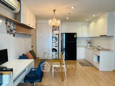 Modern open-layout kitchen with dining area and built-in appliances in stylish apartment.