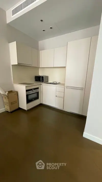 Modern kitchen with sleek cabinetry and built-in appliances in a minimalist design.