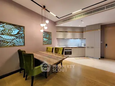 Modern kitchen with elegant dining area and stylish lighting