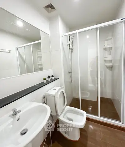 Modern bathroom with sleek shower enclosure and elegant fixtures