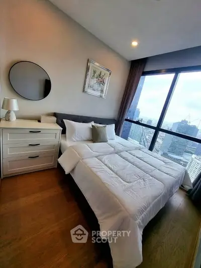 Luxurious bedroom with stunning city view and elegant decor