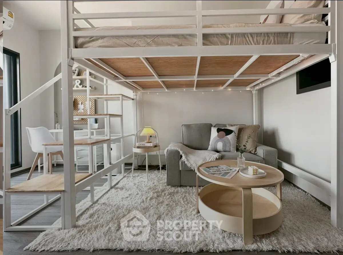 Modern loft-style living room with cozy seating and stylish decor