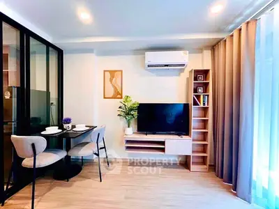 Modern living room with sleek furniture and air conditioning in a stylish apartment.