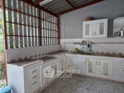 Charming rustic kitchen with open layout and vintage cabinetry