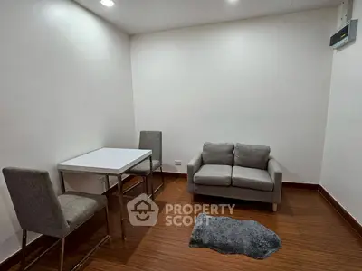 Cozy minimalist living room with modern furniture and wooden flooring