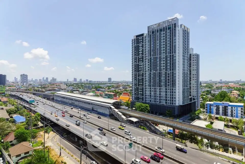 Stunning high-rise building with panoramic city views and convenient highway access.