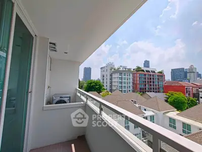 Spacious balcony with city view in modern apartment, perfect for relaxation and enjoying urban skyline.