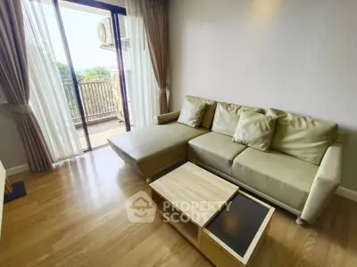 Modern living room with cozy sofa and balcony view