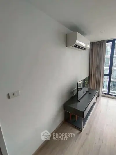 Modern living room with air conditioning and large window view