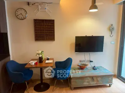 Cozy living room with modern decor and wall-mounted TV