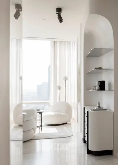 Luxurious modern living room with panoramic city view and elegant white furniture.