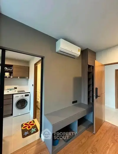Modern apartment interior with air conditioning and laundry area