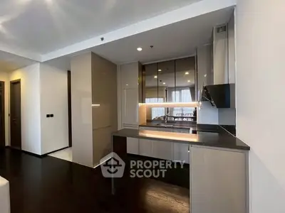 Modern kitchen with sleek cabinets and open layout in luxury apartment