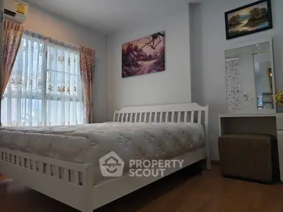 Cozy bedroom with natural light and elegant decor