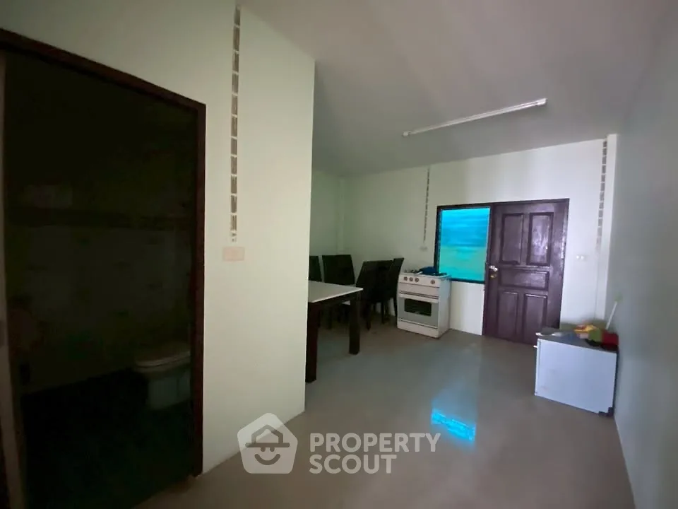Cozy kitchen with dining area and modern appliances in a compact layout.