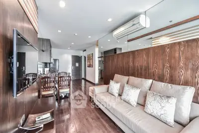 Spacious modern living room with elegant wooden flooring and stylish decor