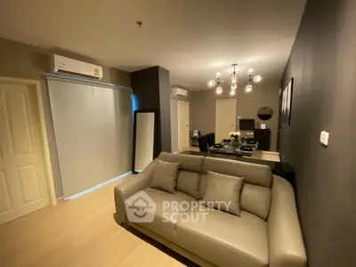 Modern living room with stylish decor and comfortable seating in a contemporary apartment.