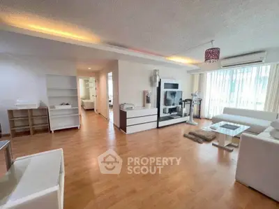 Spacious modern living room with stylish decor and natural light