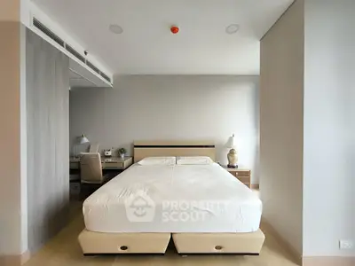 Spacious modern bedroom with minimalist design and neutral tones